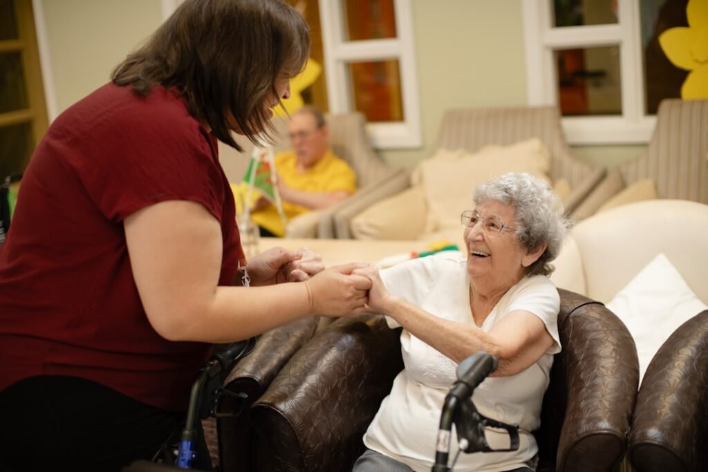Caregiver helping elderly patient, sign of needing a home nurse in Gurgaon