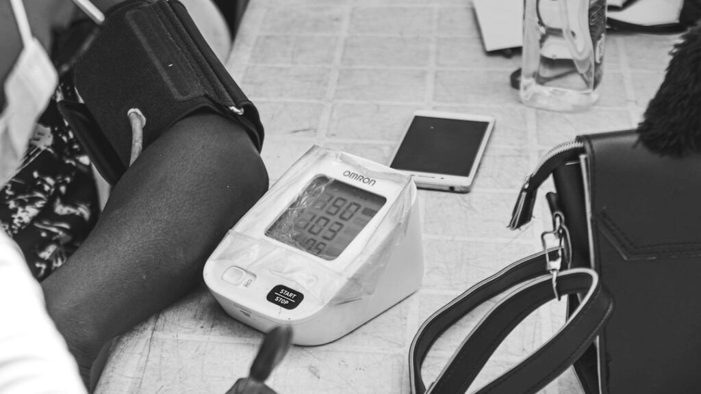 Nurse checking blood pressure, home nursing care after surgery in Delhi